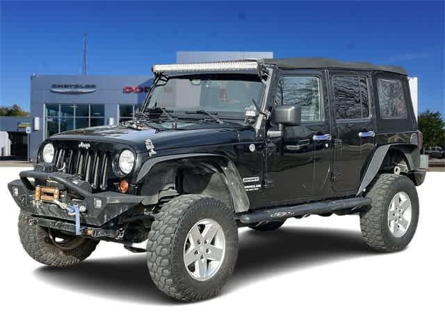 used 2011 Jeep Wrangler Unlimited car, priced at $15,824