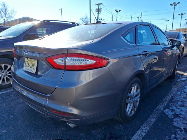 used 2014 Ford Fusion car, priced at $10,594