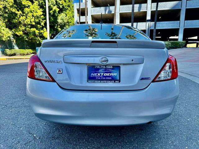 used 2014 Nissan Versa car, priced at $3,999