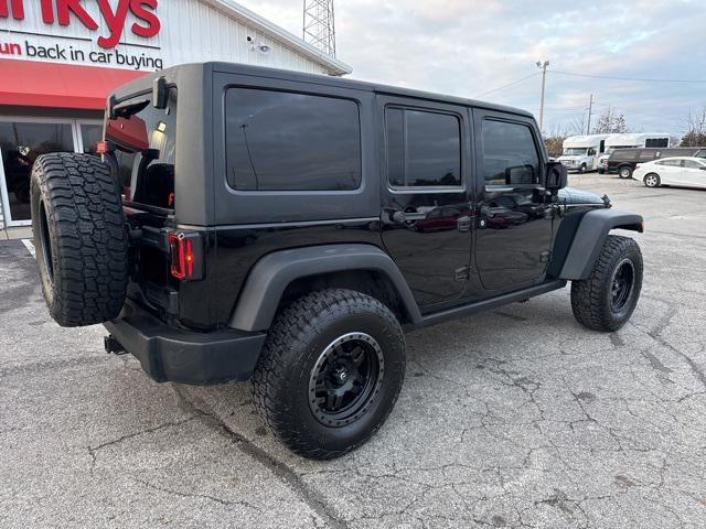 used 2011 Jeep Wrangler Unlimited car, priced at $13,679