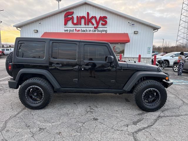 used 2011 Jeep Wrangler Unlimited car, priced at $13,679