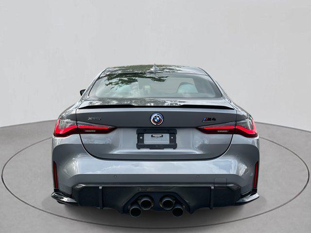used 2023 BMW M4 car, priced at $77,000