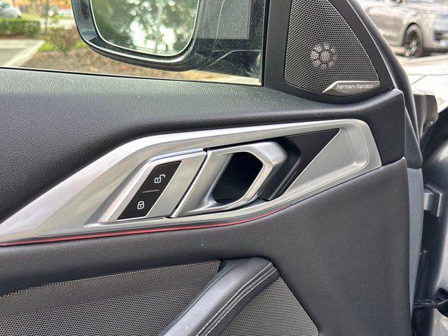 used 2023 BMW M4 car, priced at $77,000