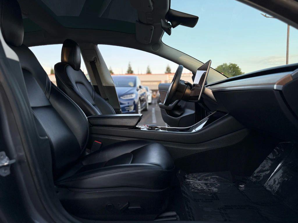 used 2018 Tesla Model 3 car, priced at $14,999
