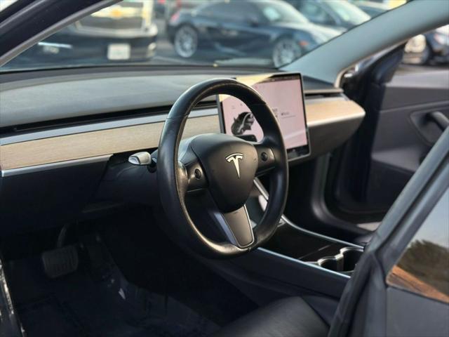 used 2018 Tesla Model 3 car, priced at $15,499