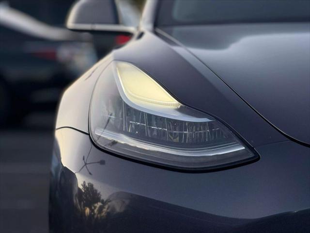 used 2018 Tesla Model 3 car, priced at $15,499