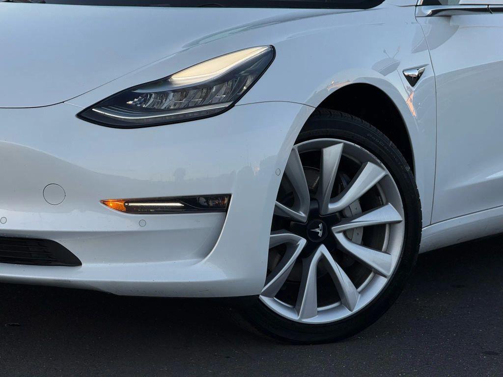 used 2018 Tesla Model 3 car, priced at $15,499