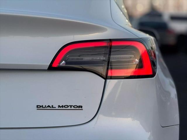 used 2018 Tesla Model 3 car, priced at $13,499