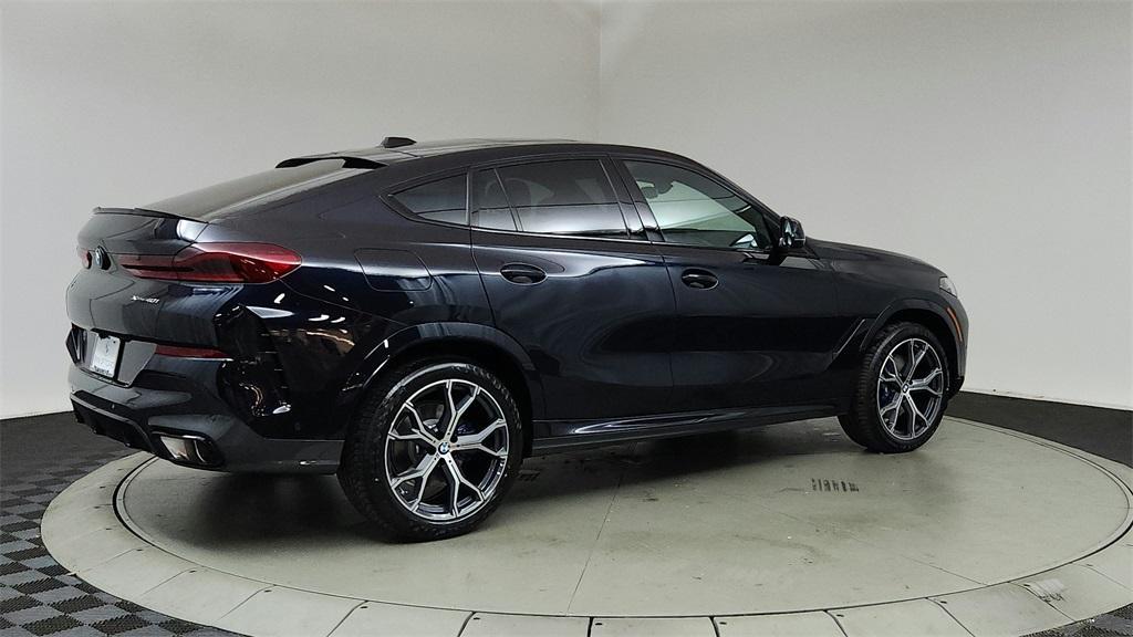 new 2025 BMW X6 car, priced at $85,685