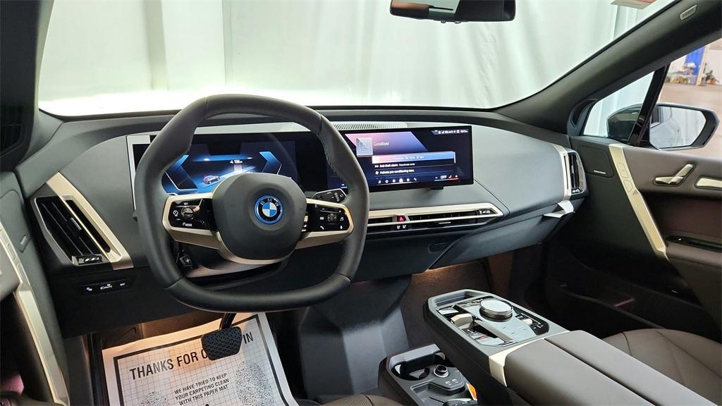 new 2025 BMW iX car, priced at $99,050