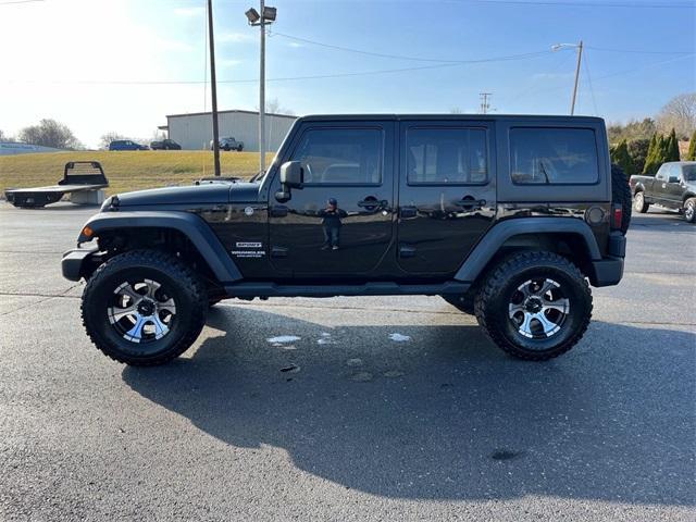 used 2011 Jeep Wrangler Unlimited car, priced at $15,235