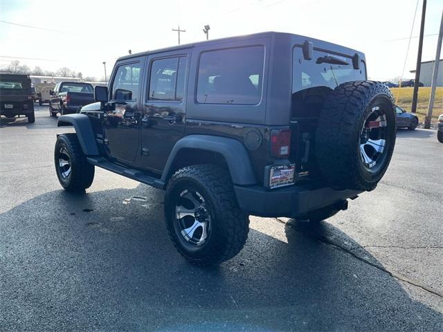 used 2011 Jeep Wrangler Unlimited car, priced at $15,235