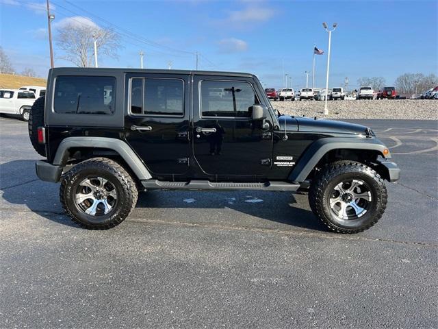 used 2011 Jeep Wrangler Unlimited car, priced at $15,235