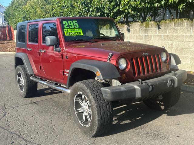 used 2010 Jeep Wrangler Unlimited car, priced at $13,995