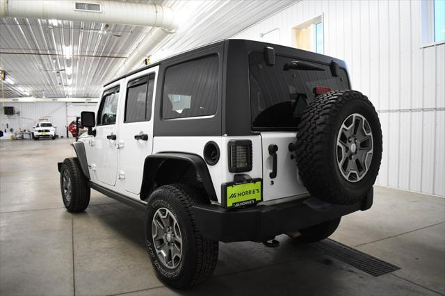 used 2014 Jeep Wrangler Unlimited car, priced at $16,490