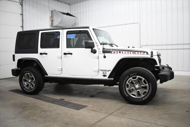 used 2014 Jeep Wrangler Unlimited car, priced at $16,490