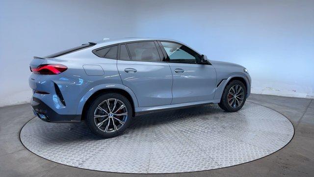 new 2025 BMW X6 car, priced at $77,275