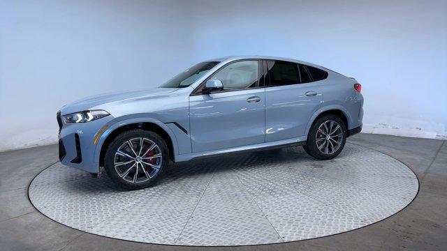 new 2025 BMW X6 car, priced at $77,275