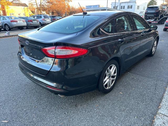 used 2014 Ford Fusion car, priced at $6,981