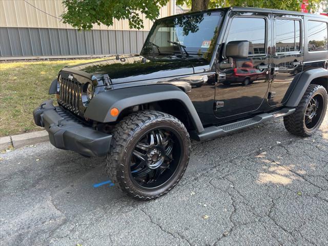 used 2011 Jeep Wrangler Unlimited car, priced at $9,999