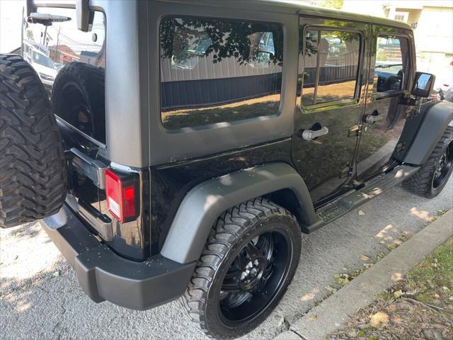 used 2011 Jeep Wrangler Unlimited car, priced at $9,999