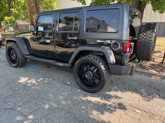 used 2011 Jeep Wrangler Unlimited car, priced at $9,999