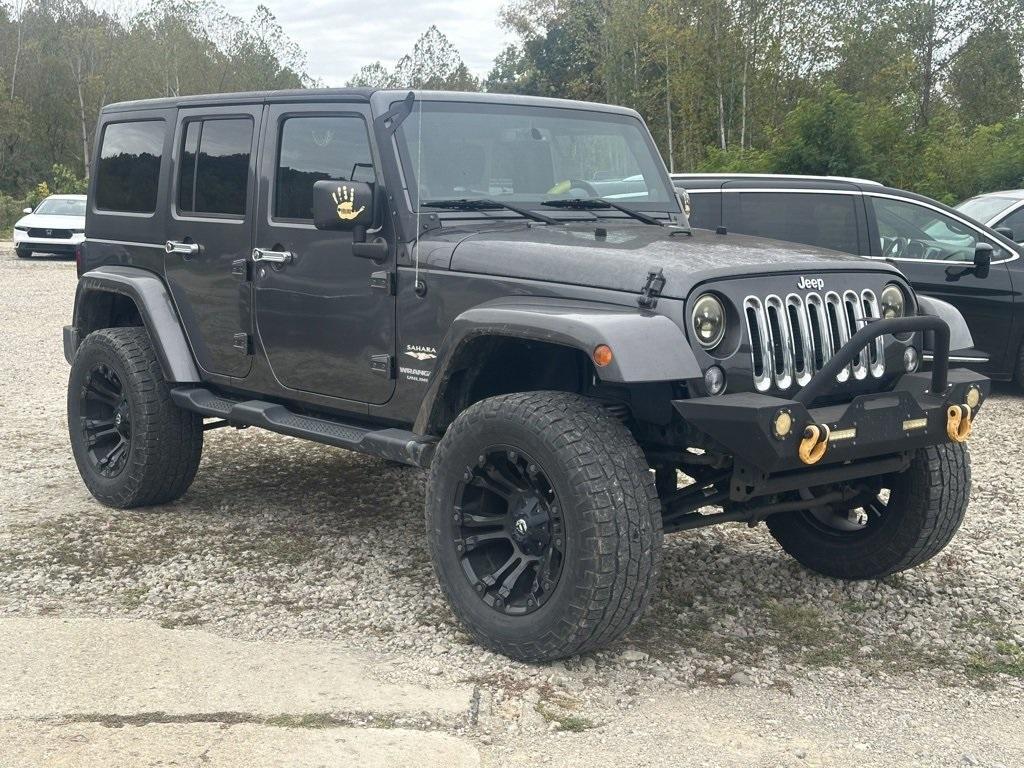 used 2014 Jeep Wrangler Unlimited car, priced at $16,980