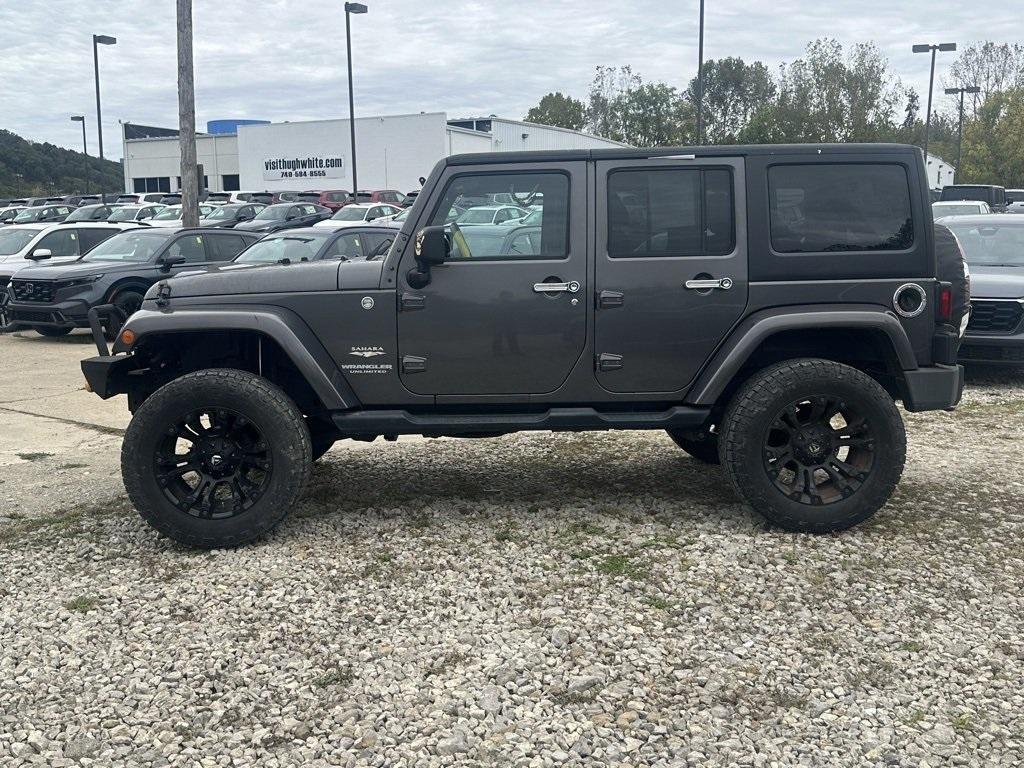 used 2014 Jeep Wrangler Unlimited car, priced at $16,980