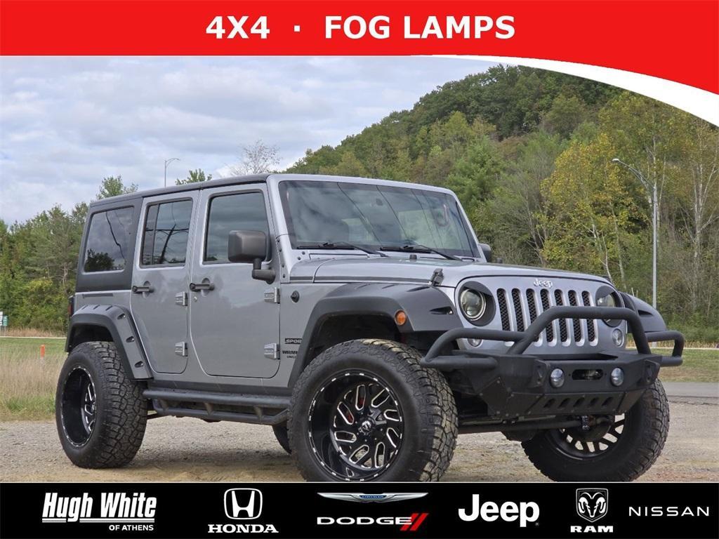 used 2015 Jeep Wrangler Unlimited car, priced at $13,421