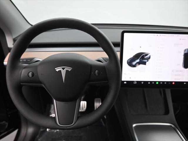 used 2025 Tesla Model Y car, priced at $41,603