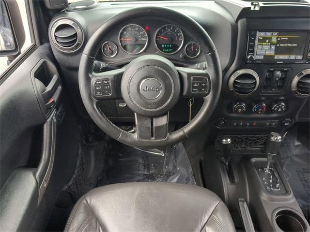 used 2015 Jeep Wrangler Unlimited car, priced at $17,477