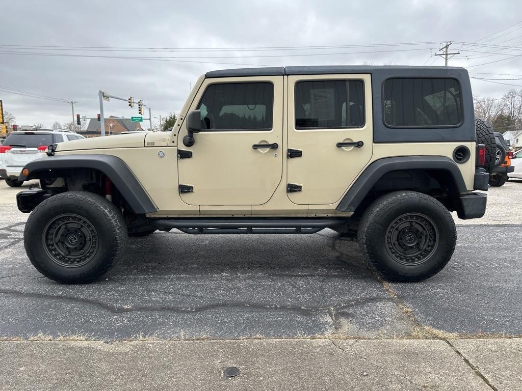 used 2011 Jeep Wrangler Unlimited car, priced at $16,036