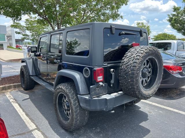 used 2015 Jeep Wrangler Unlimited car, priced at $15,297