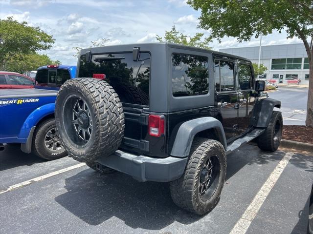 used 2015 Jeep Wrangler Unlimited car, priced at $15,297