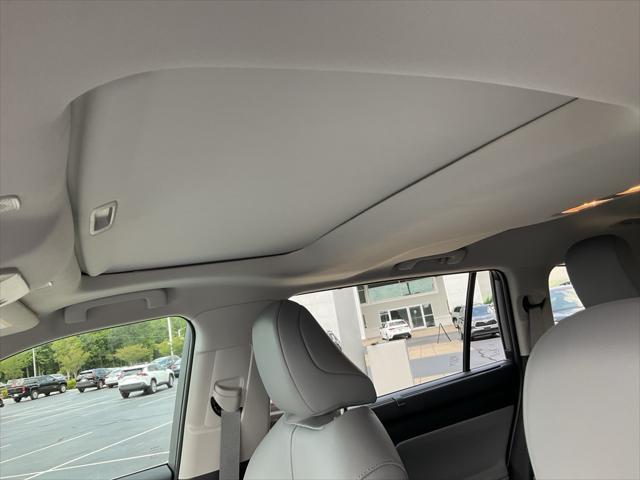 used 2025 Toyota Highlander Hybrid car, priced at $49,999