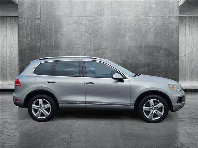 used 2012 Volkswagen Touareg Hybrid car, priced at $9,853