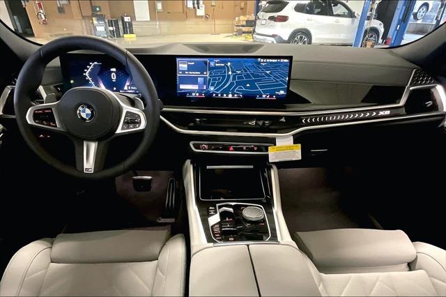 new 2025 BMW X6 car, priced at $77,875