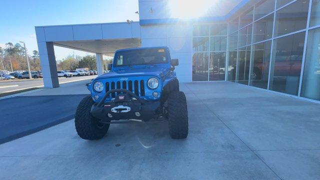 used 2016 Jeep Wrangler Unlimited car, priced at $25,974