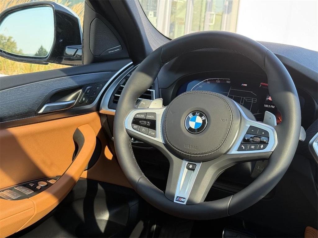 used 2025 BMW X4 car, priced at $54,499