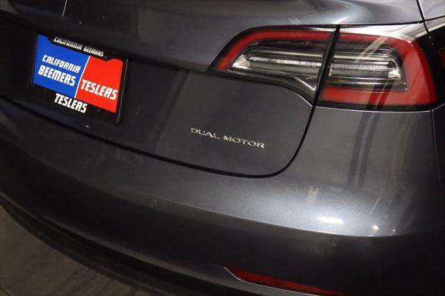 used 2023 Tesla Model 3 car, priced at $28,490