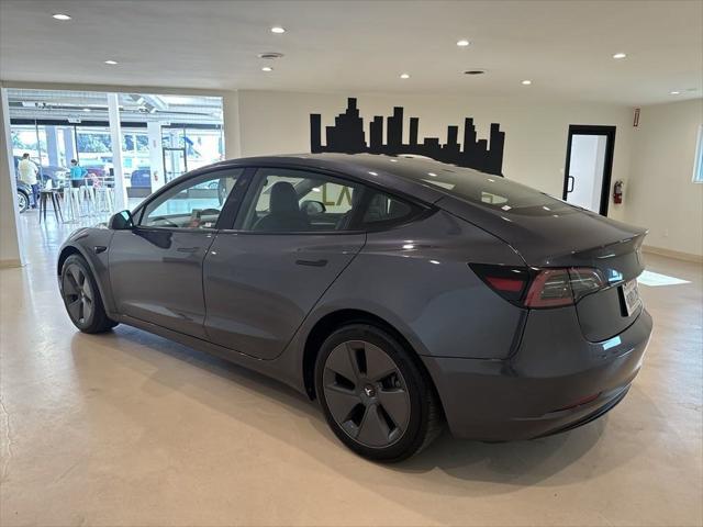 used 2023 Tesla Model 3 car, priced at $27,599