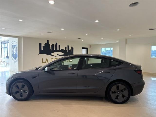 used 2023 Tesla Model 3 car, priced at $27,599