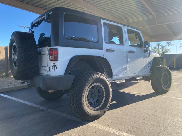 used 2014 Jeep Wrangler Unlimited car, priced at $14,891