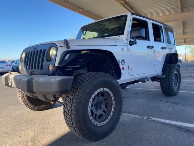 used 2014 Jeep Wrangler Unlimited car, priced at $14,891
