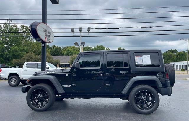 used 2011 Jeep Wrangler Unlimited car, priced at $13,980