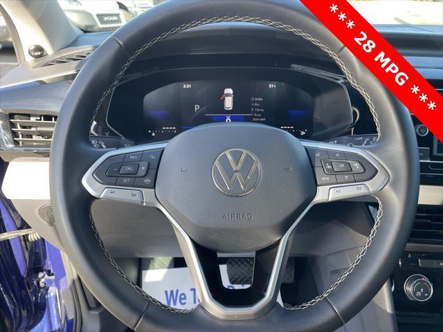 used 2023 Volkswagen Taos car, priced at $20,000