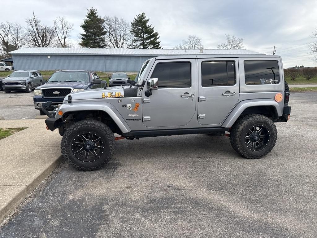 used 2013 Jeep Wrangler Unlimited car, priced at $16,994
