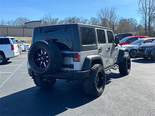 used 2014 Jeep Wrangler Unlimited car, priced at $15,401