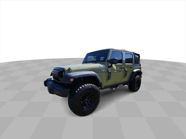 used 2013 Jeep Wrangler Unlimited car, priced at $15,894