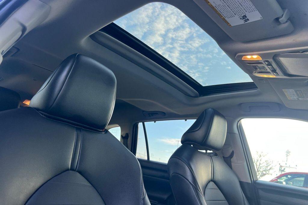 used 2021 Toyota Highlander Hybrid car, priced at $32,500